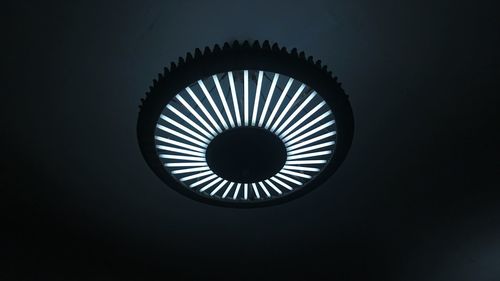 Close-up of electric lamp against black background