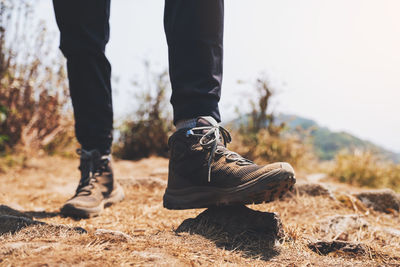 Low section of people standing on land