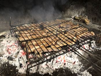 High angle view of meat on barbecue grill