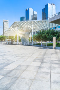 Modern buildings in city against clear sky