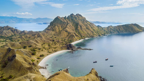 High angle view of mountains by sea