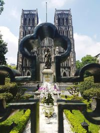 Low angle view of statue against temple