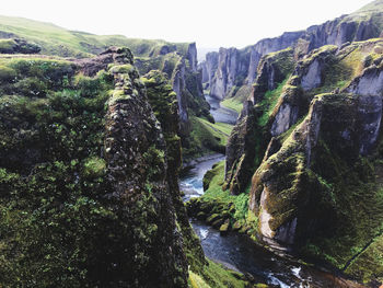 Scenic view of waterfall against clear sky