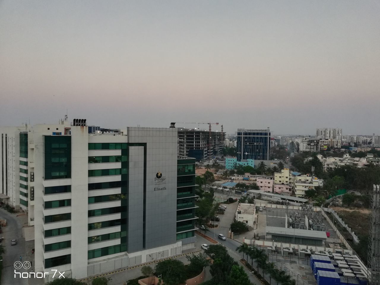 HIGH ANGLE VIEW OF MODERN BUILDINGS AGAINST CLEAR SKY