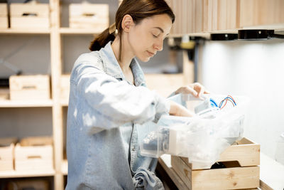 Side view of woman working