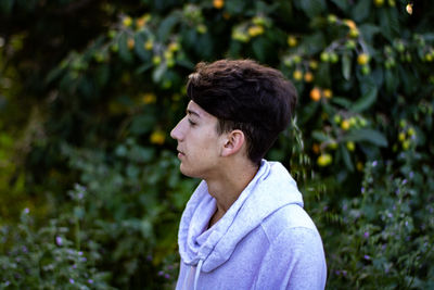 Portrait of young man looking away