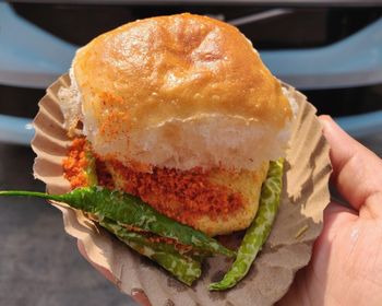 Close-up of hand holding ice cream