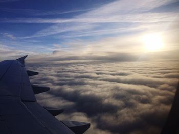 Aerial view of cloudscape seen through airplane window