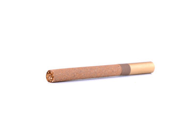 Close-up of cigarette against white background