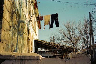 Low angle view of clothes hanging on building