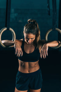 Woman holding gymnastic rings 