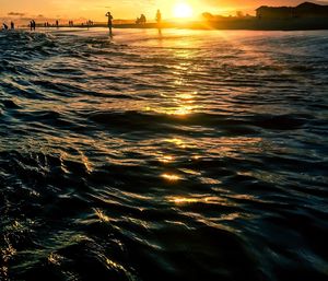 Scenic view of sea against sky at sunset