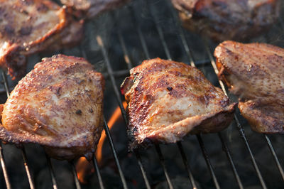 Close-up of meat on barbecue grill