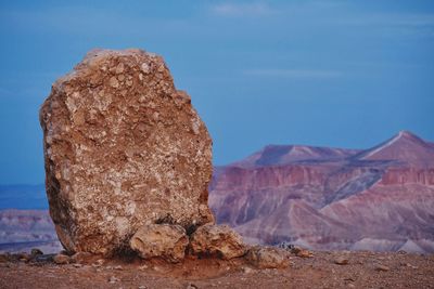 Rock formations in desert against sky