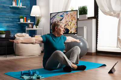Man sitting on table at home