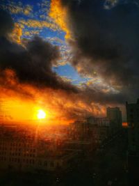 Scenic view of dramatic sky during sunset