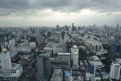 High angle view of modern buildings in city against sky