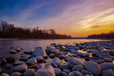 Scenic view of lake against sky during sunset