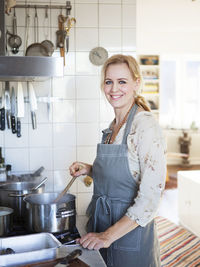 Smiling woman cooking