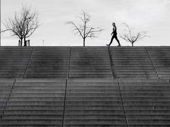 Low angle view of woman against sky