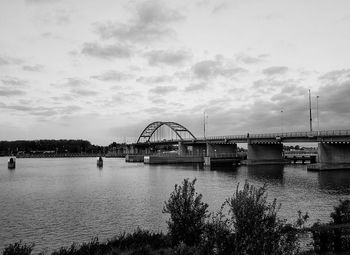 Bridge over river against sky