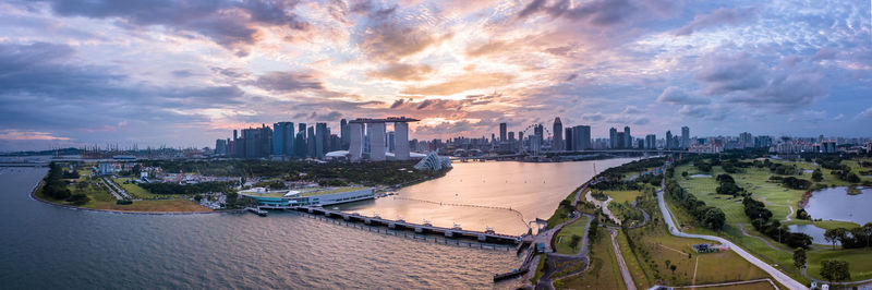 Panoramic view of city against cloudy sky