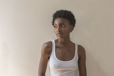 Portrait of a young woman with hoop earrings