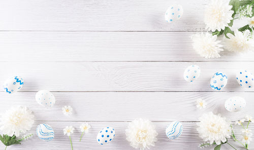 High angle view of white flowers on wooden table