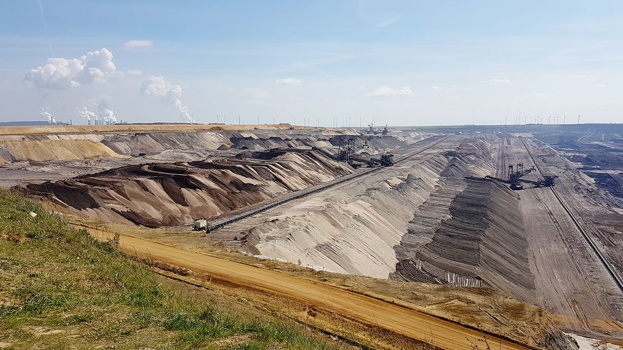 sky, environment, nature, industry, landscape, cloud, mining, day, land, power generation, no people, geology, mine, scenics - nature, outdoors, aerial photography, environmental issues, non-urban scene, mountain, beauty in nature, mineral