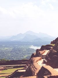 High angle view of mountain range against cloudy sky