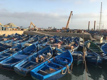 Boats moored at harbor