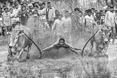 Panoramic view of people splashing water