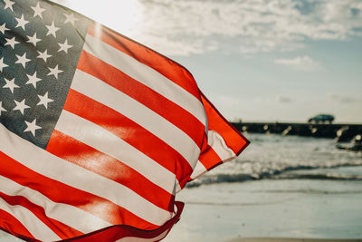 Close-up of flag against sky