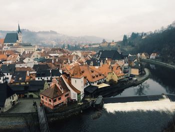 High angle view of townscape against cloudy sky