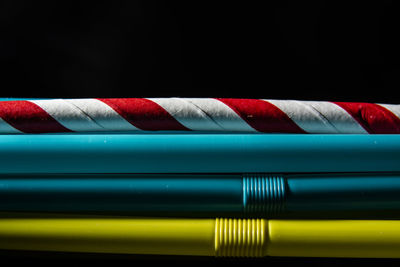 Close-up of multi colored pencils against black background