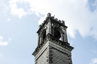 Low angle view of clock tower against sky