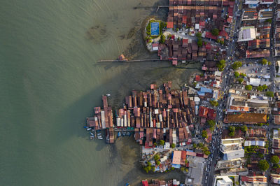 High angle view of buildings by river in city