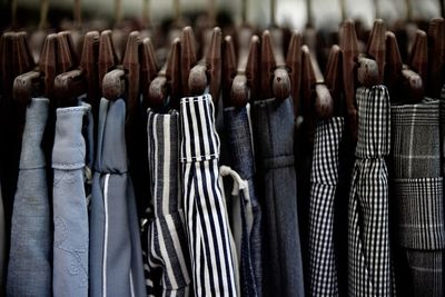 Close-up of clothes hanging on wood