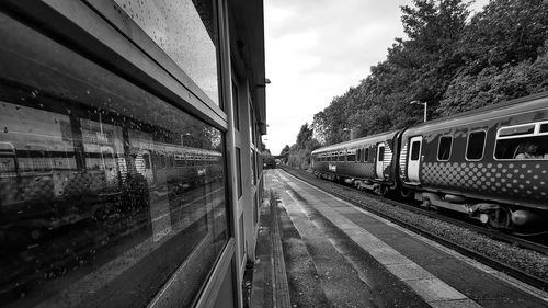 Train at railroad station against sky