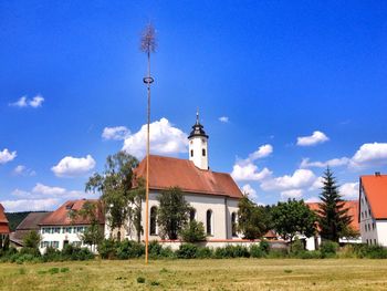 Low angle view of building against blue sky