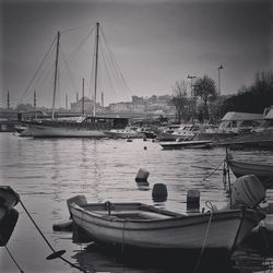 Boats moored at harbor