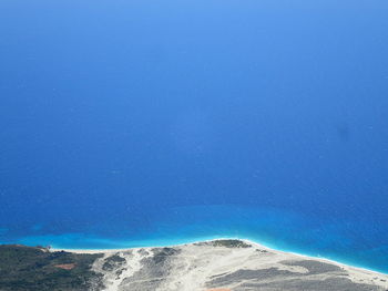 High angle view of beach against clear blue sky