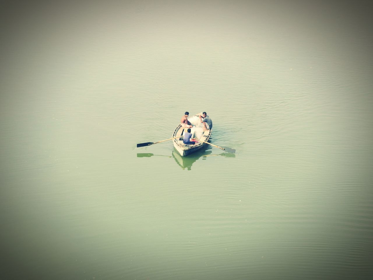 PEOPLE IN BOAT AT LAKE