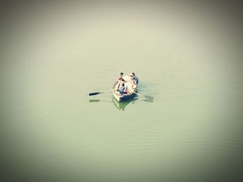 People on boat in lake