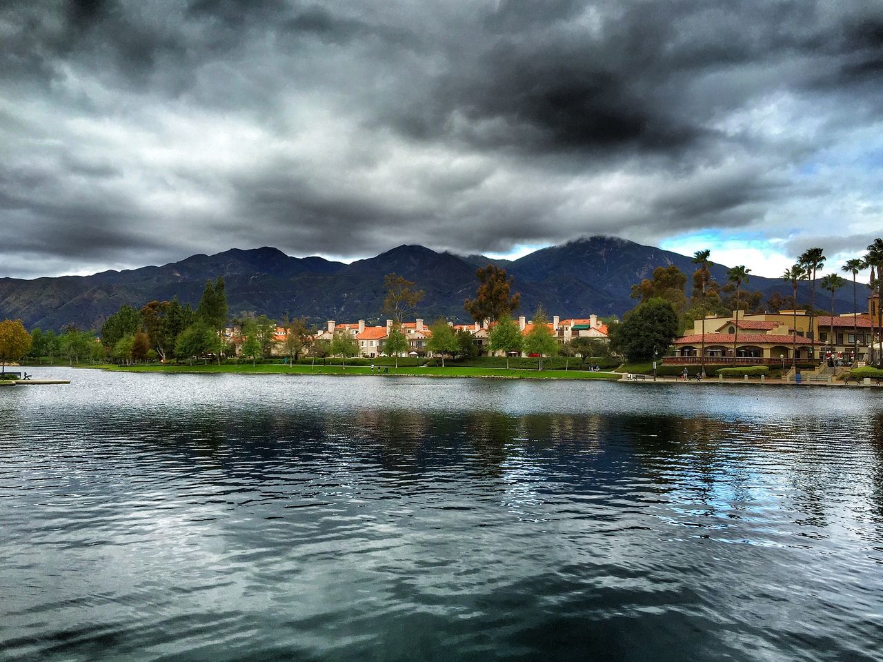 sky, mountain, cloud - sky, water, cloudy, mountain range, waterfront, lake, cloud, building exterior, built structure, weather, scenics, architecture, overcast, tranquil scene, tranquility, beauty in nature, nature, nautical vessel