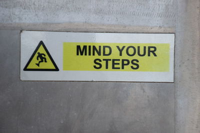 Close-up of warning sign on wall