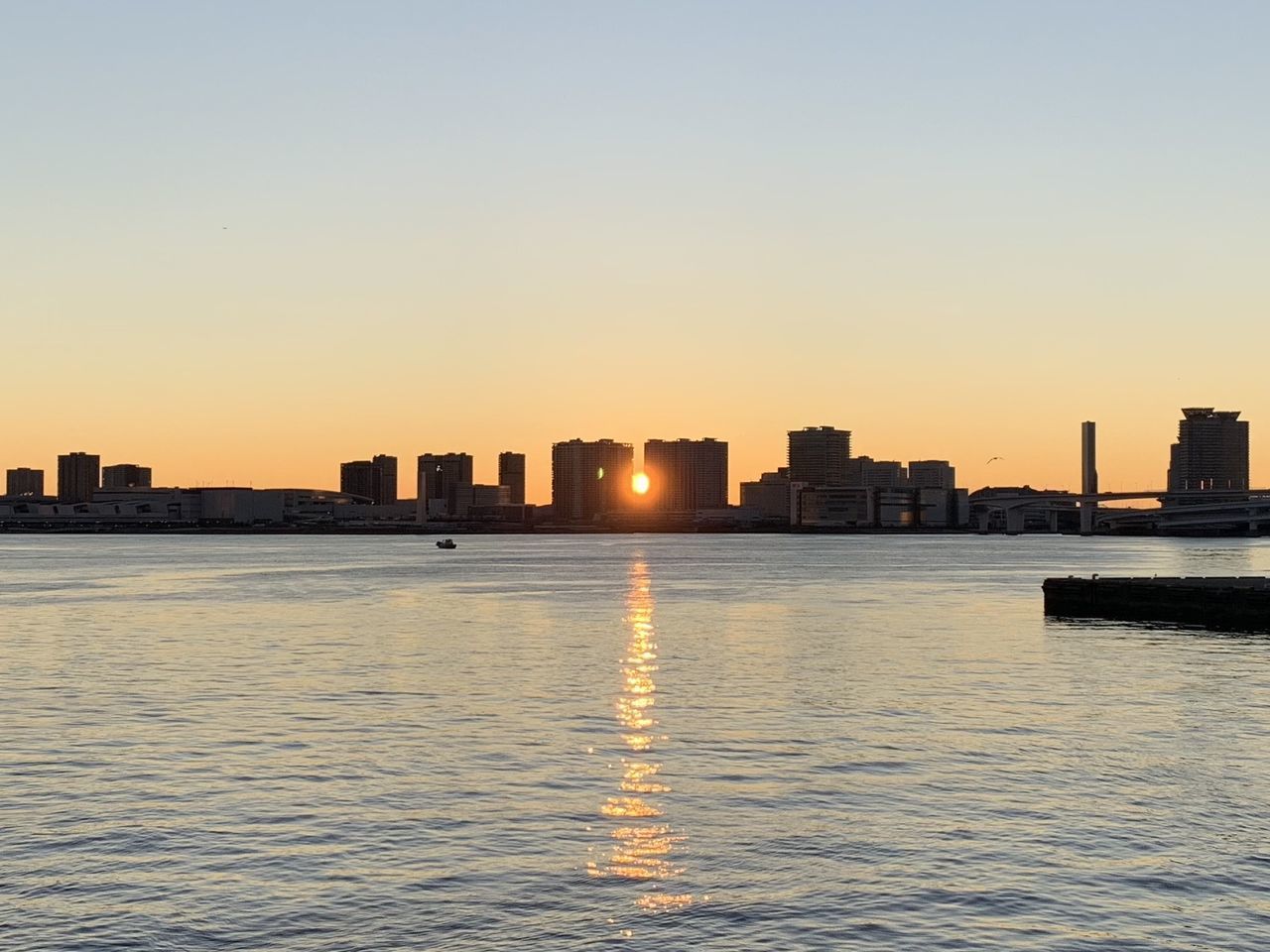 sky, architecture, building exterior, built structure, sunset, water, city, waterfront, building, no people, nature, clear sky, reflection, urban skyline, landscape, sea, office building exterior, copy space, cityscape, outdoors, skyscraper