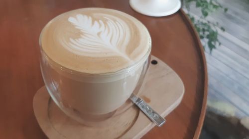 High angle view of coffee cup on table