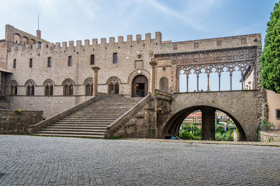 Arch bridge against building