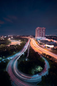 High angle view of light trails on road at night